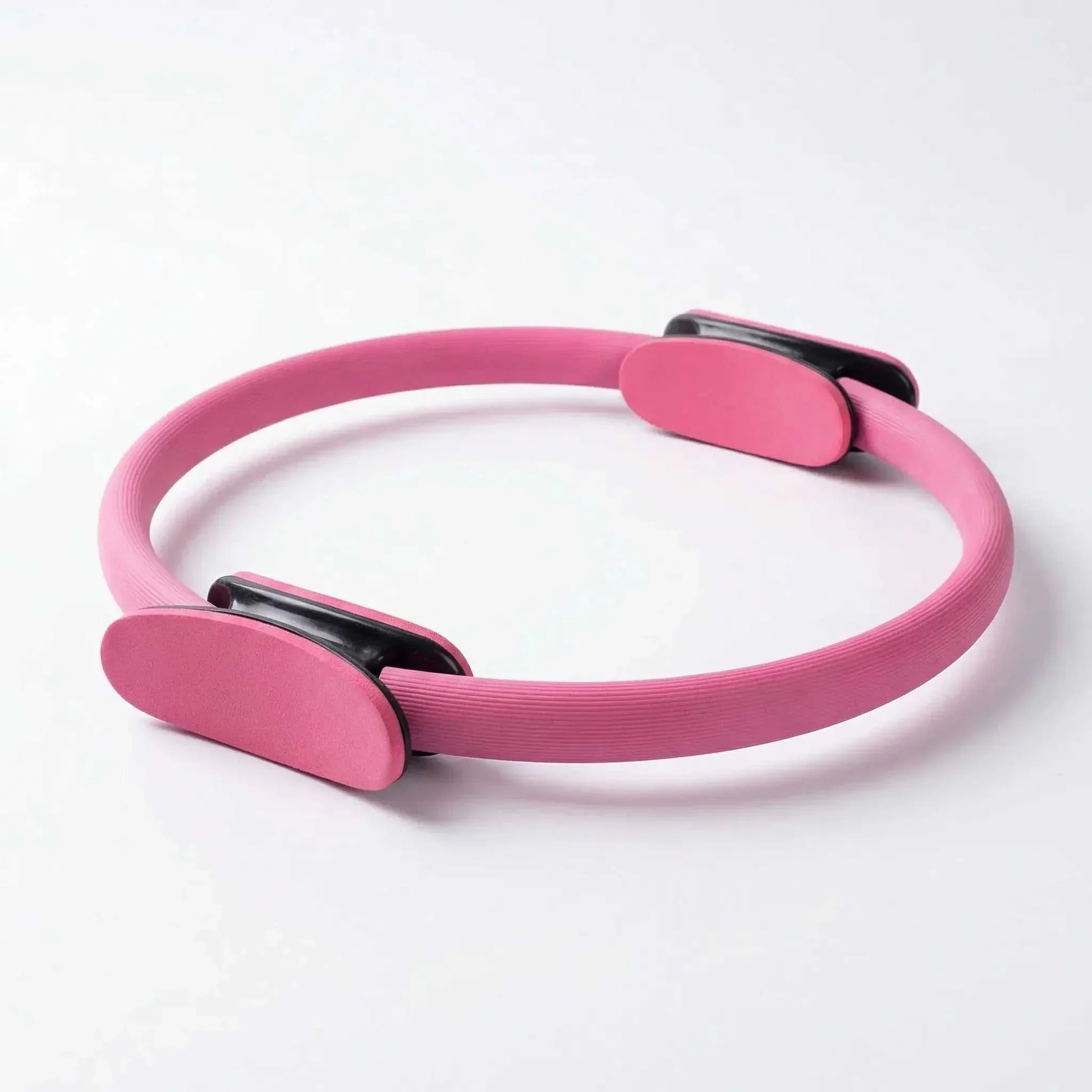anneau Pilates rose poigner noir rose fond blanc
